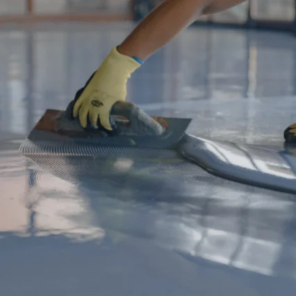 man applying epoxy on floor service millersburg pa