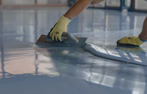 man applying epoxy on floor service millersburg pa